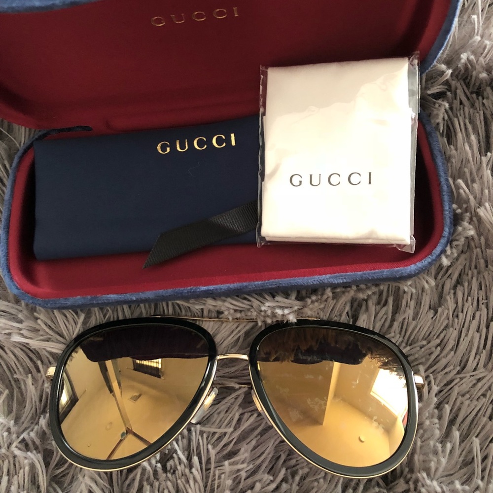 Gucci Aviators.. Black and Gold